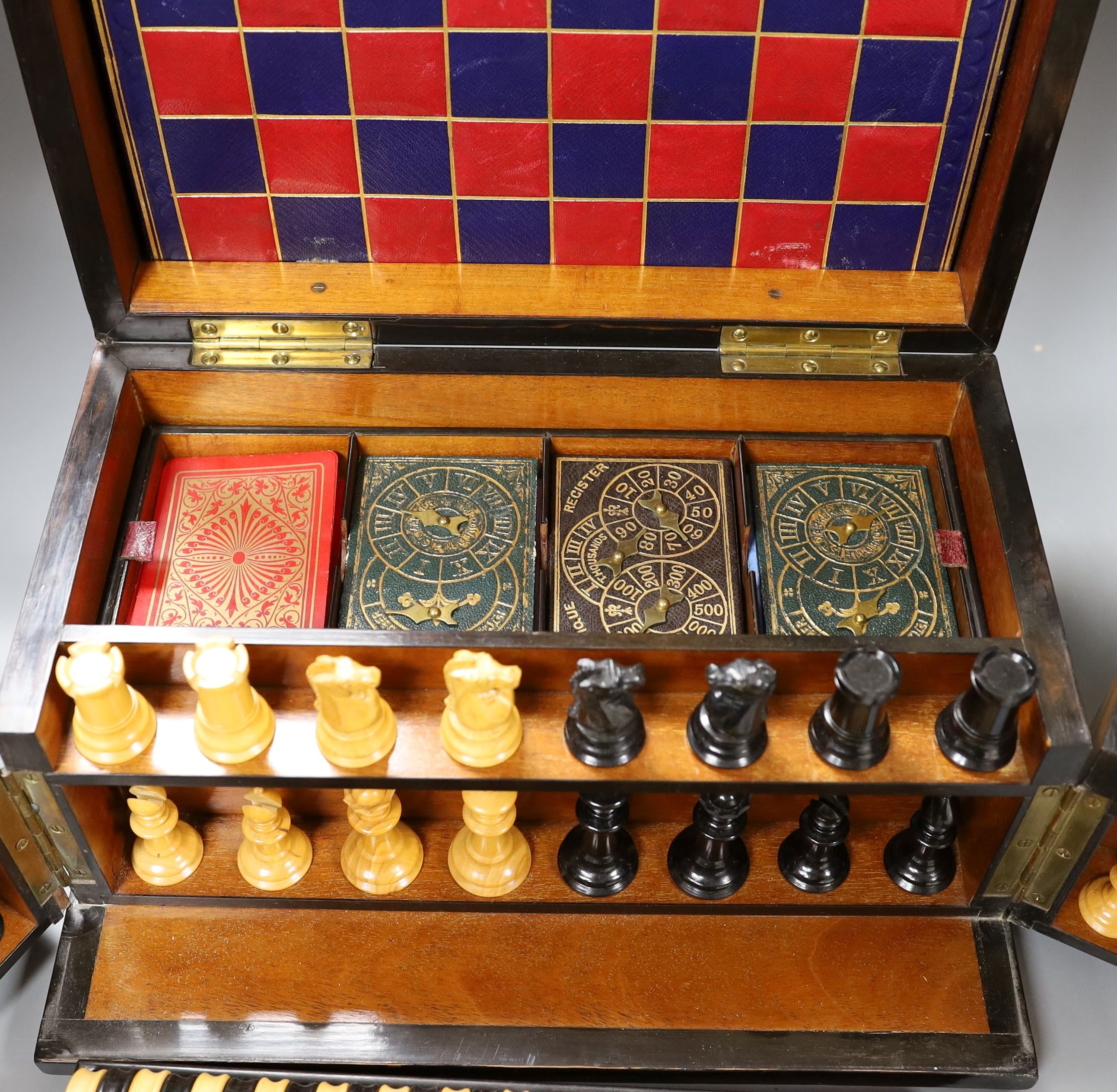 A Victorian walnut games compendium, 33cm wide